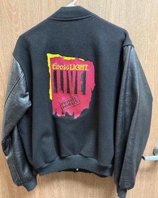 Sale Photo Thumbnail #66: Coors Light Live Private Domain patch on left breast, larger logo on there back. Has an embroidered name "Mac" on the right breast. See Photos form details.