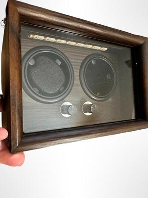Sale Photo Thumbnail #581: Dual Watch Winder housed in a dark wood case with a glass display.