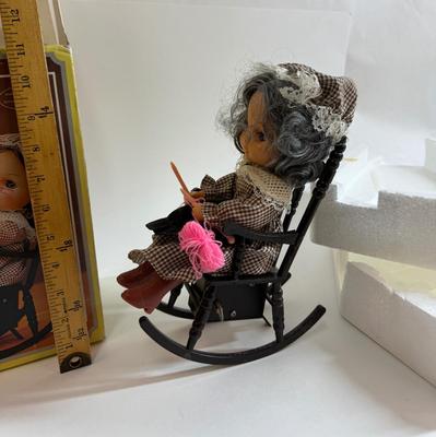 Sale Photo Thumbnail #259: In original box. Wind-up music plays. One of the chair's arms was broken and repaired, now it is un-attached but can be repaired again.