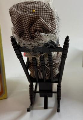 Sale Photo Thumbnail #257: In original box. Wind-up music plays. One of the chair's arms was broken and repaired, now it is un-attached but can be repaired again.