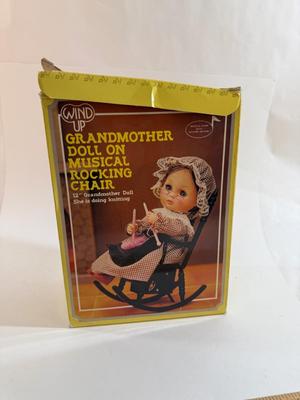 Sale Photo Thumbnail #253: In original box. Wind-up music plays. One of the chair's arms was broken and repaired, now it is un-attached but can be repaired again.