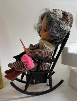 Sale Photo Thumbnail #258: In original box. Wind-up music plays. One of the chair's arms was broken and repaired, now it is un-attached but can be repaired again.