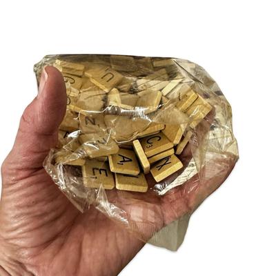 Sale Photo Thumbnail #694: Vintage Scrabble Game in Box- appears unused except the bag of tiles has been opened. Tiles have not been counted.