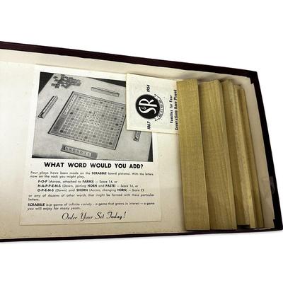 Sale Photo Thumbnail #695: Vintage Scrabble Game in Box- appears unused except the bag of tiles has been opened. Tiles have not been counted.