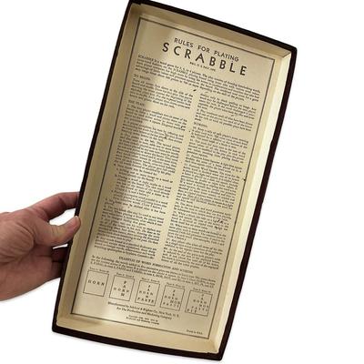 Sale Photo Thumbnail #696: Vintage Scrabble Game in Box- appears unused except the bag of tiles has been opened. Tiles have not been counted.