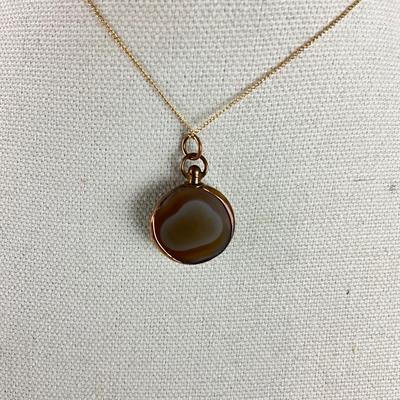 S683 10k Yellow gold Banded Buckeye Onyx Round Stone Pendant