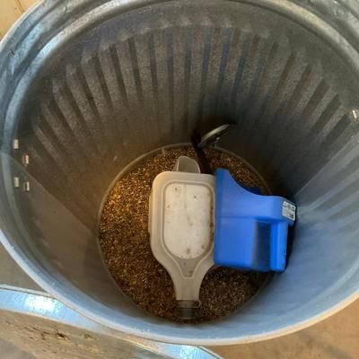G969 31 Gallon Galvanized Utility Can With Bird Feeder Inside Feed Scooper.