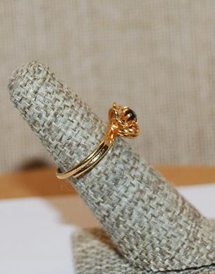 Size 5-6 Adjustable Bright Gold Colored "FLOWER" RING with Single PURPLE Center Stone and Gold Tone Adjustable Band (1.9g)