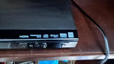 MAGNAVOX DVD PLAYER WITH AN ASSORTMENT OF MOVIES