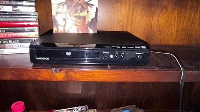 MAGNAVOX DVD PLAYER WITH AN ASSORTMENT OF MOVIES