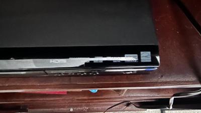MAGNAVOX DVD PLAYER WITH AN ASSORTMENT OF MOVIES