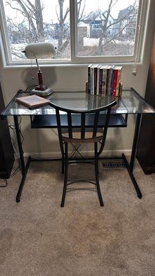 GLASS TOP DESK, CHAIR, BOOKS AND OTT-LITE LAMP
