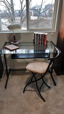 GLASS TOP DESK, CHAIR, BOOKS AND OTT-LITE LAMP
