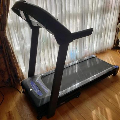 LOT 29: Horizon Fitness Treadmill-Feather Light Folding
