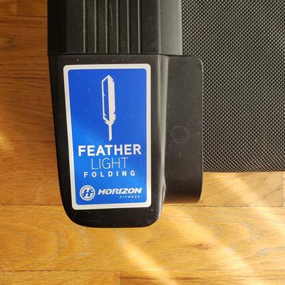 LOT 29: Horizon Fitness Treadmill-Feather Light Folding