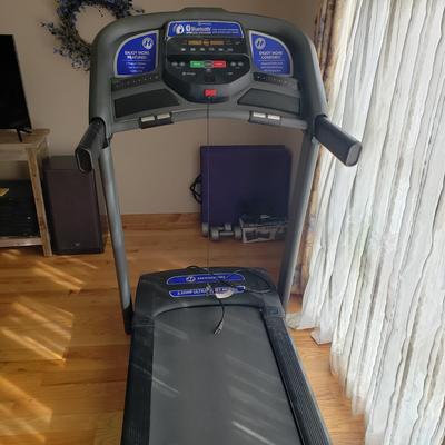 LOT 29: Horizon Fitness Treadmill-Feather Light Folding