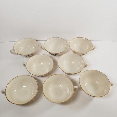 LOT 174: Lenox Holiday Dinnerware Service for 8 with Salt & Pepper, Creamer & Sugar & Extras