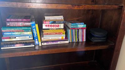 AN ASSORTMENT OF BOOKS AND CDS