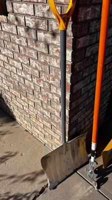 SNOW SHOVELS AND A TREE SAW