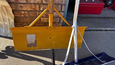 SNOW SHOVELS AND A TREE SAW