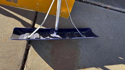 SNOW SHOVELS AND A TREE SAW