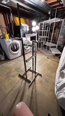 ADJUSTABLE CLOTHING RACK AND A FOLDING GARMENT RACK