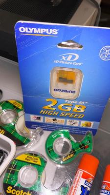 37”-90” FLAT TV WALL MOUNT, 2GB OLYMPUS SD CARD AND MISC OFFICE SUPPLIES