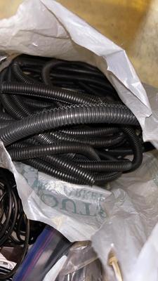 BOX OF MISC CORDS, HDMI, EXTENSION, CABLE AUXILIARY AND A LARGE BAG OR CORD COVER