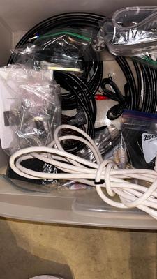 BOX OF MISC CORDS, HDMI, EXTENSION, CABLE AUXILIARY AND A LARGE BAG OR CORD COVER