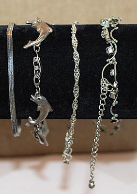 Collection of 4 Silver-Colored Style BRACELETS Including 1 with Dolphins