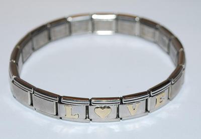 Silver Tone Elastic "LOVE' BRACELET (2¼" Opening) - Marked "ADD-A-CHARM ©" with Gold Colored Letters...