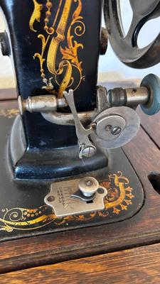 NICE EARLY 1900’s MINNESOTA TREADLE SEWING MACHINE WITH ACCESSORIES, NOTIONS AND ORIGINAL PAPERWORK