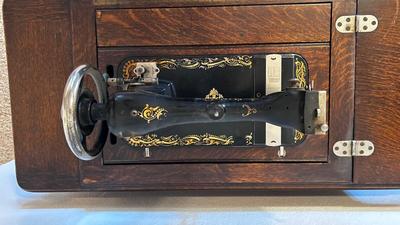 NICE EARLY 1900’s MINNESOTA TREADLE SEWING MACHINE WITH ACCESSORIES, NOTIONS AND ORIGINAL PAPERWORK