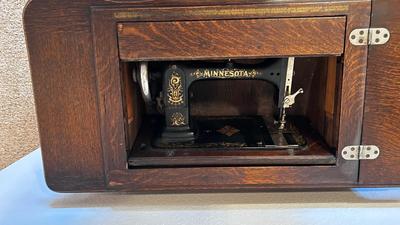 NICE EARLY 1900’s MINNESOTA TREADLE SEWING MACHINE WITH ACCESSORIES, NOTIONS AND ORIGINAL PAPERWORK