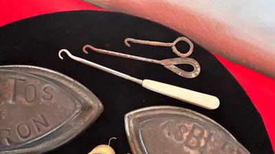 ANTIQUE SAD IRONS, THREAD SPOOLS, GUNNY SACK NEEDLES AND MORE