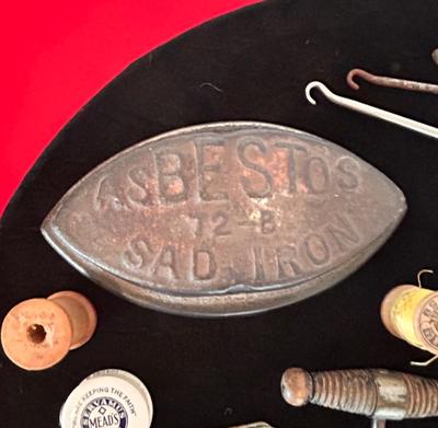 ANTIQUE SAD IRONS, THREAD SPOOLS, GUNNY SACK NEEDLES AND MORE