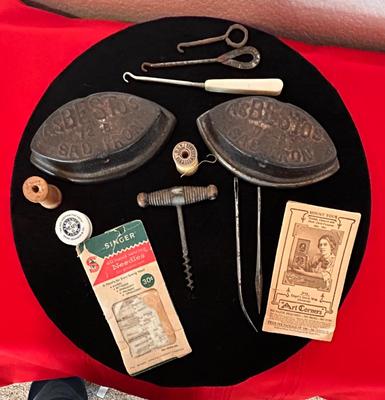 ANTIQUE SAD IRONS, THREAD SPOOLS, GUNNY SACK NEEDLES AND MORE