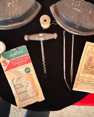 ANTIQUE SAD IRONS, THREAD SPOOLS, GUNNY SACK NEEDLES AND MORE