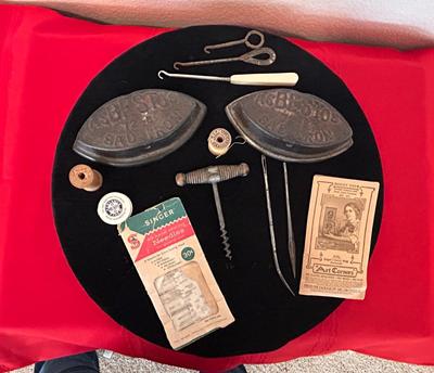 ANTIQUE SAD IRONS, THREAD SPOOLS, GUNNY SACK NEEDLES AND MORE