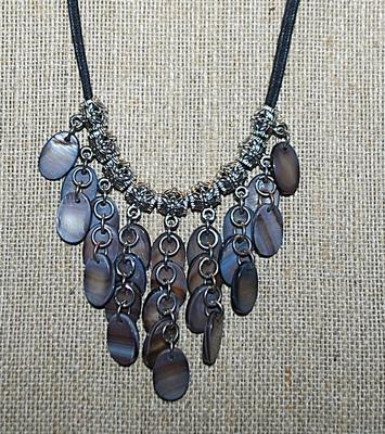 Marked "lia sophia" NECKLACE with Iridescent Style Oval Acrylic Disks + Silver Tone Barrel Accents and Cord Chain and Lobster...