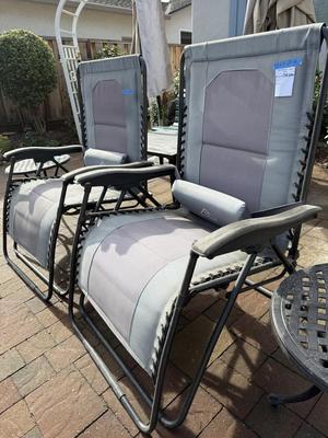 Pair Of Extra Wide Folding Chase lounges And Pair of Side Round Tables