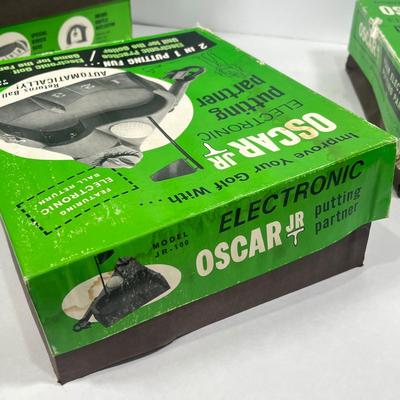 LOT 54A: Six Vintage Oscar Jr. Electronic Putting Partners