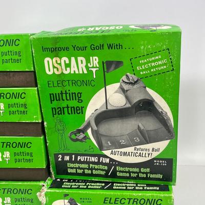 LOT 54A: Six Vintage Oscar Jr. Electronic Putting Partners
