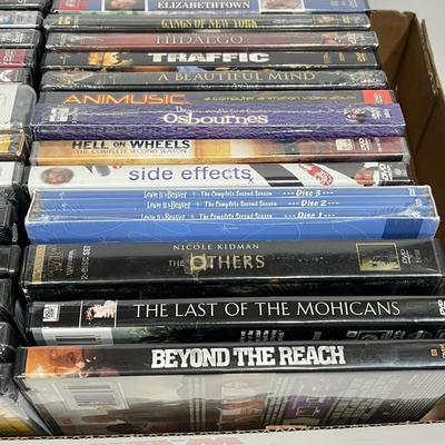 LOT 67: DVDs and VHS Tapes - Most New, Sealed