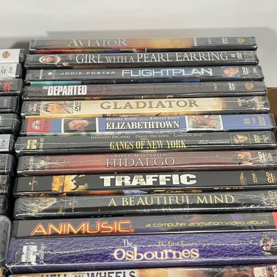 LOT 67: DVDs and VHS Tapes - Most New, Sealed