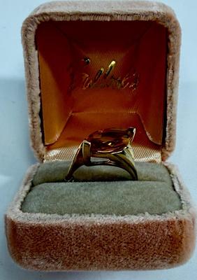 Sale Photo Thumbnail #5: Ring has an oval topaz stone approx. 5/8" x 5/16". total ring weight is 4.8g.  Very nice condition.