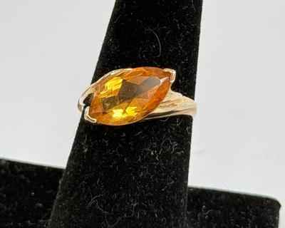 Sale Photo Thumbnail #10: Ring has an oval topaz stone approx. 5/8" x 5/16". total ring weight is 4.8g.  Very nice condition.