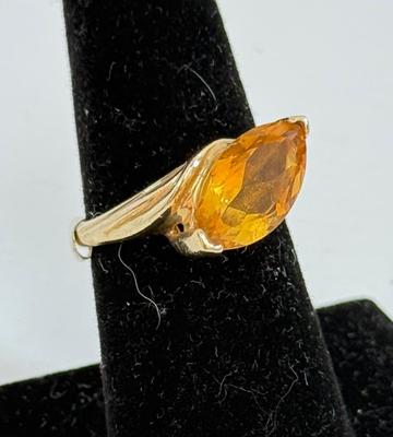 Sale Photo Thumbnail #12: Ring has an oval topaz stone approx. 5/8" x 5/16". total ring weight is 4.8g.  Very nice condition.