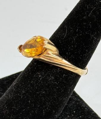Sale Photo Thumbnail #11: Ring has an oval topaz stone approx. 5/8" x 5/16". total ring weight is 4.8g.  Very nice condition.