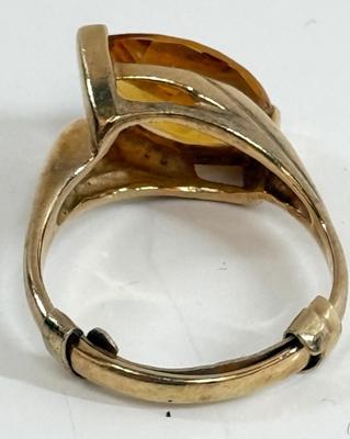 Sale Photo Thumbnail #9: Ring has an oval topaz stone approx. 5/8" x 5/16". total ring weight is 4.8g.  Very nice condition.